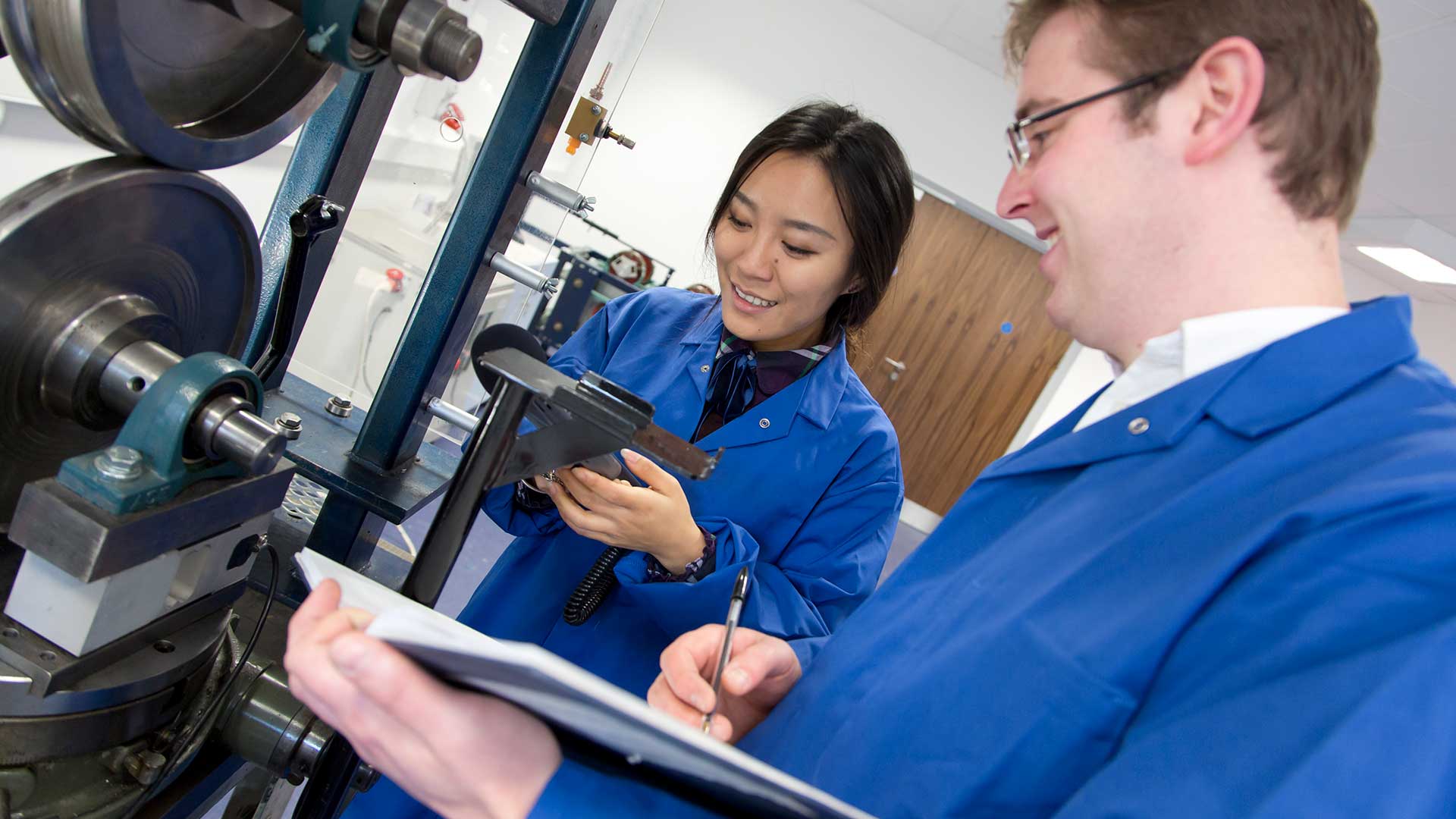 researchers working with a test rig