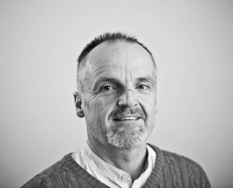 Profile picture in grey scale of Prof Liam Blunt