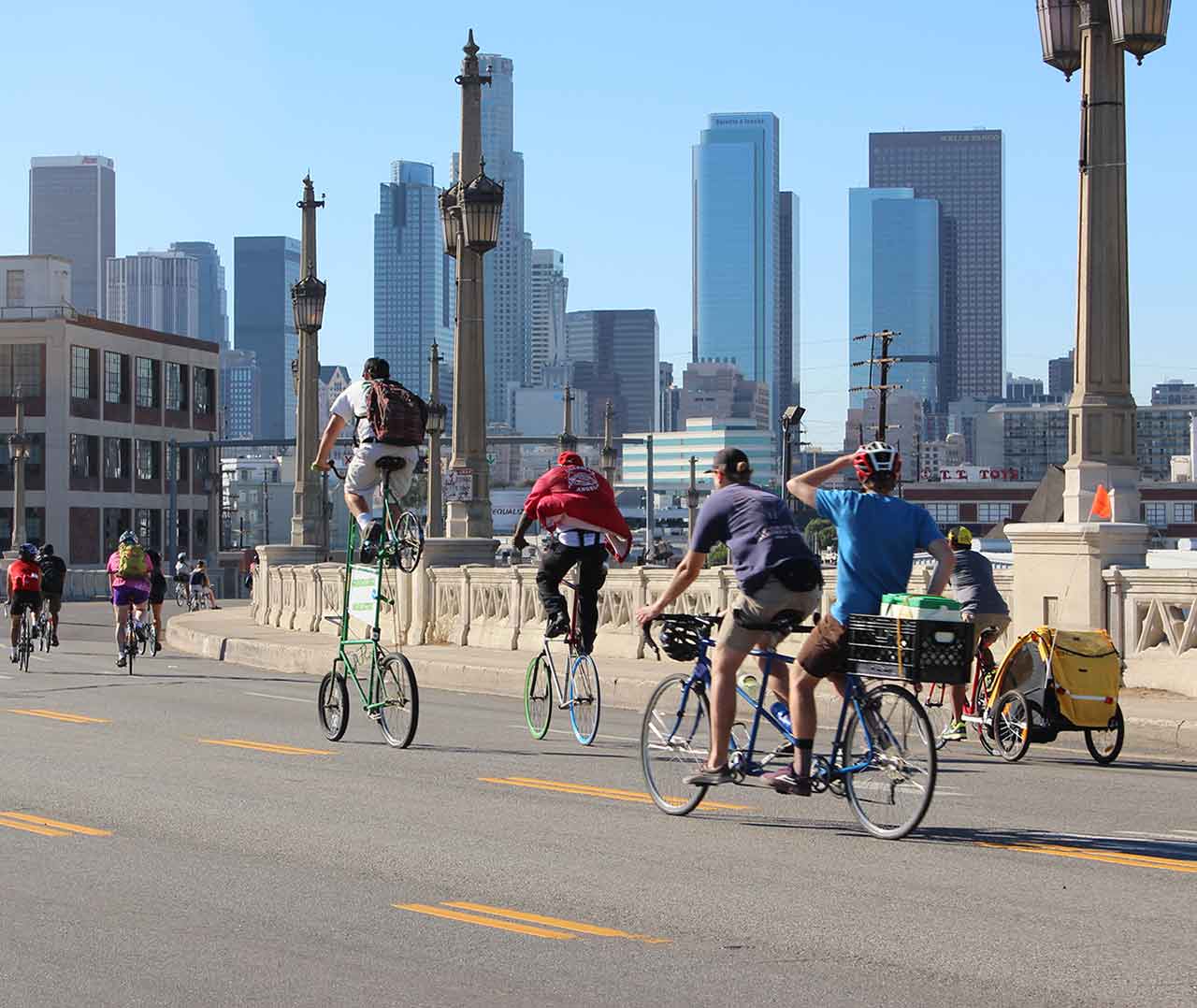 Cyclists in Los Angeles. Skyscrapers in the background