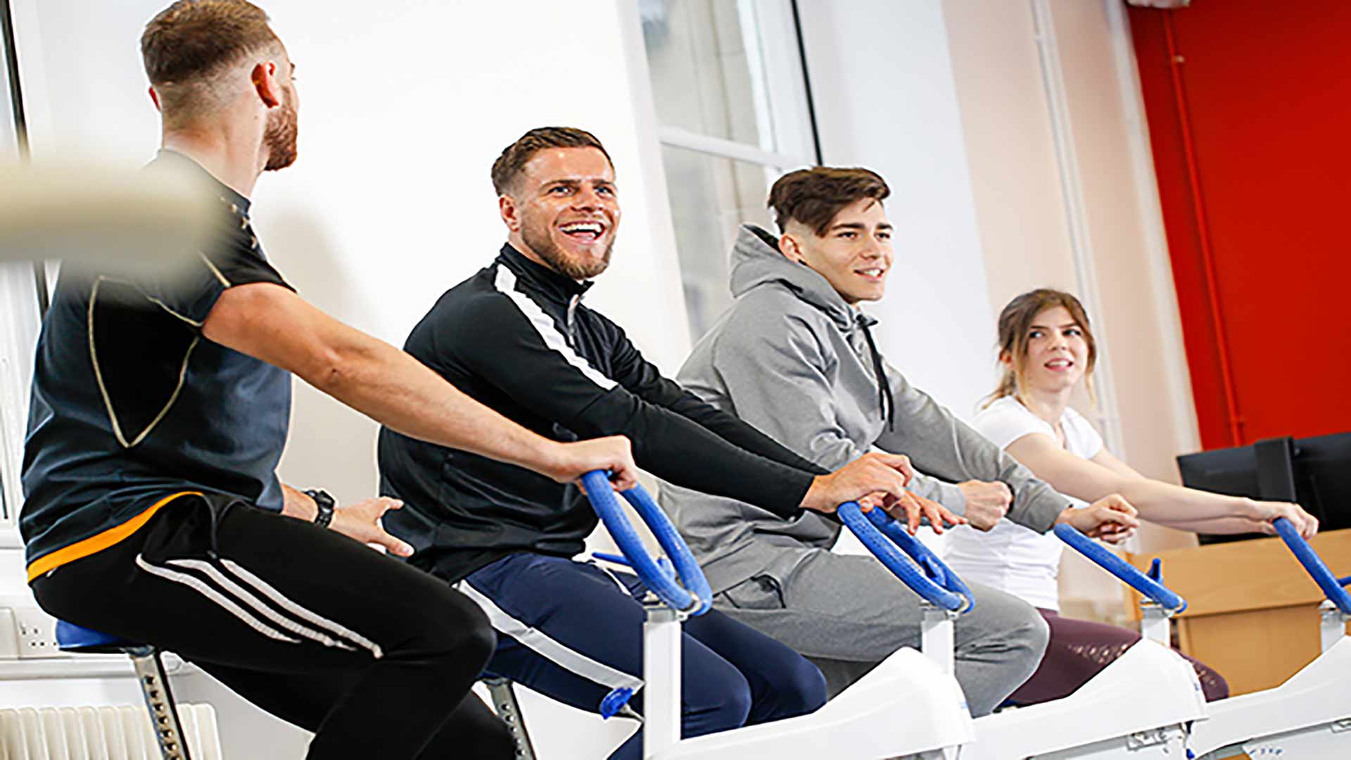 4 students on exercise bikes