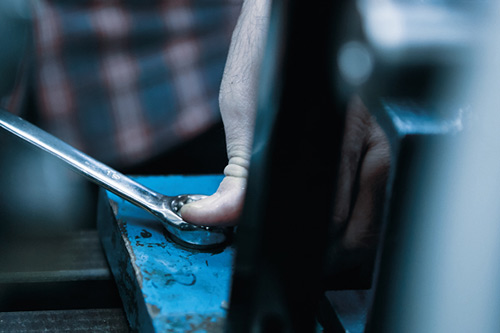 A skilled individual working on specialist machinery.